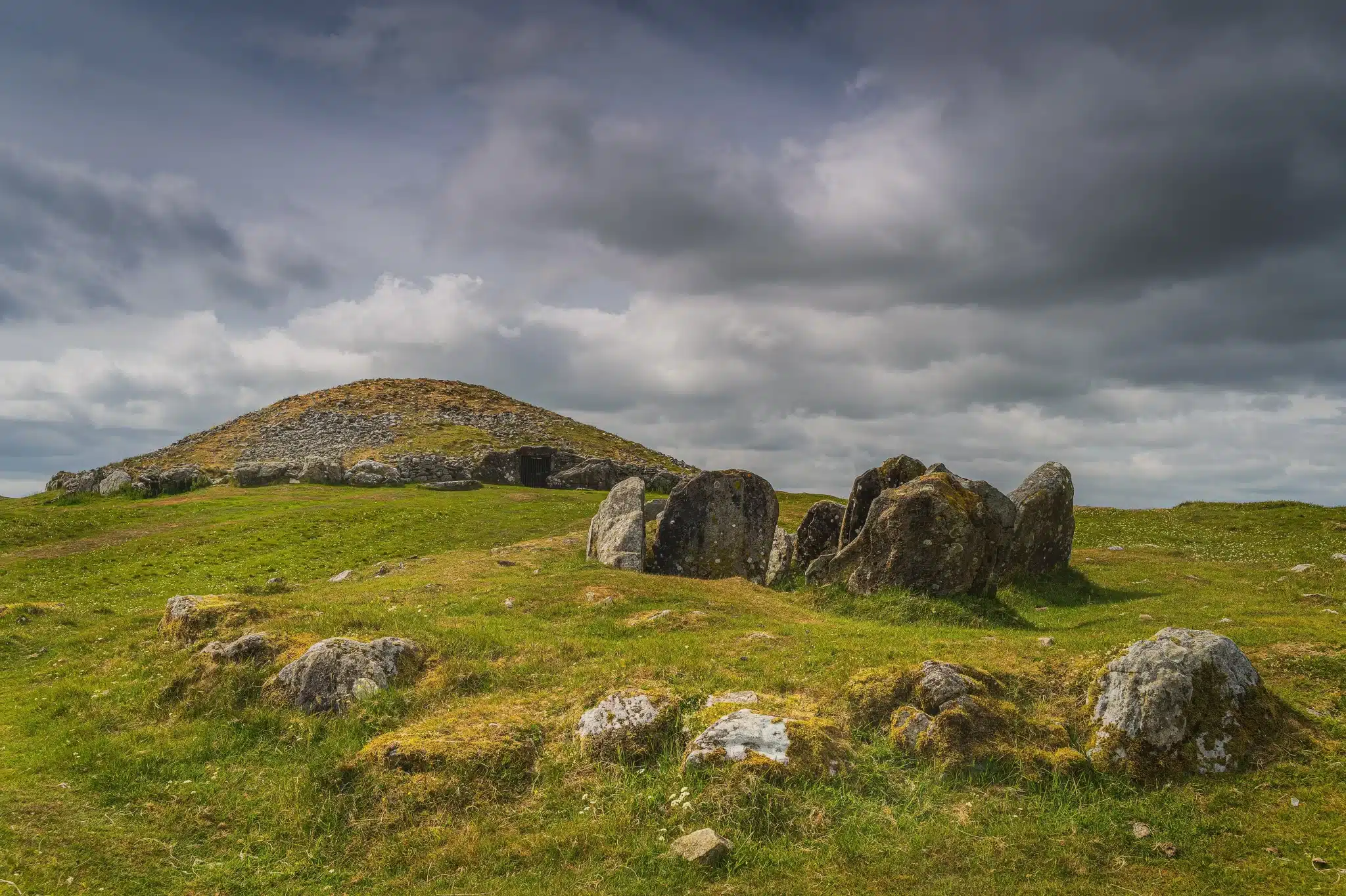 Ancient stone circle under cloudy skies in green field for green burial services in san francisco county california