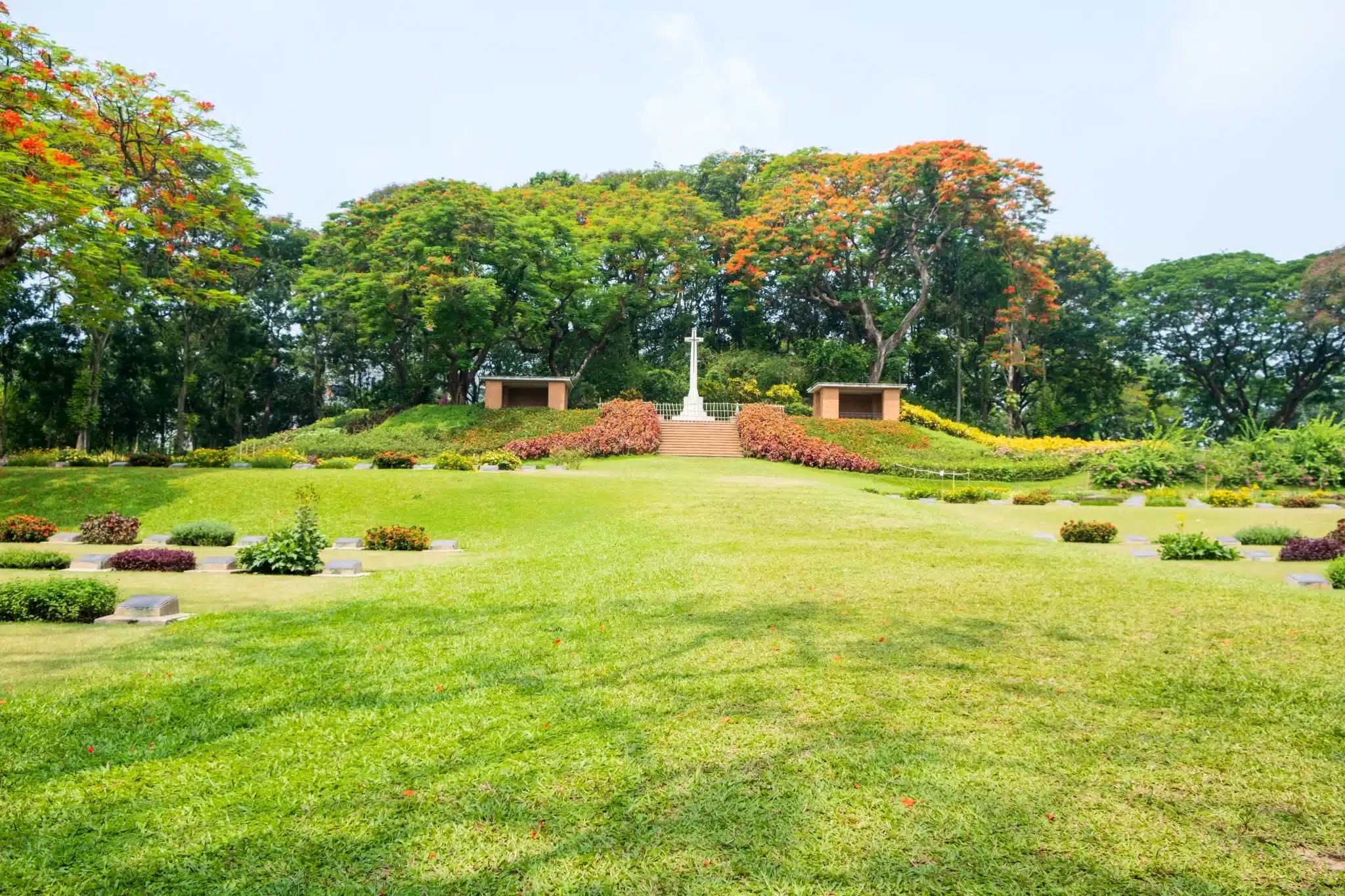 Lush garden with blooming trees and central monument for Green Burial Services in Napa County, California