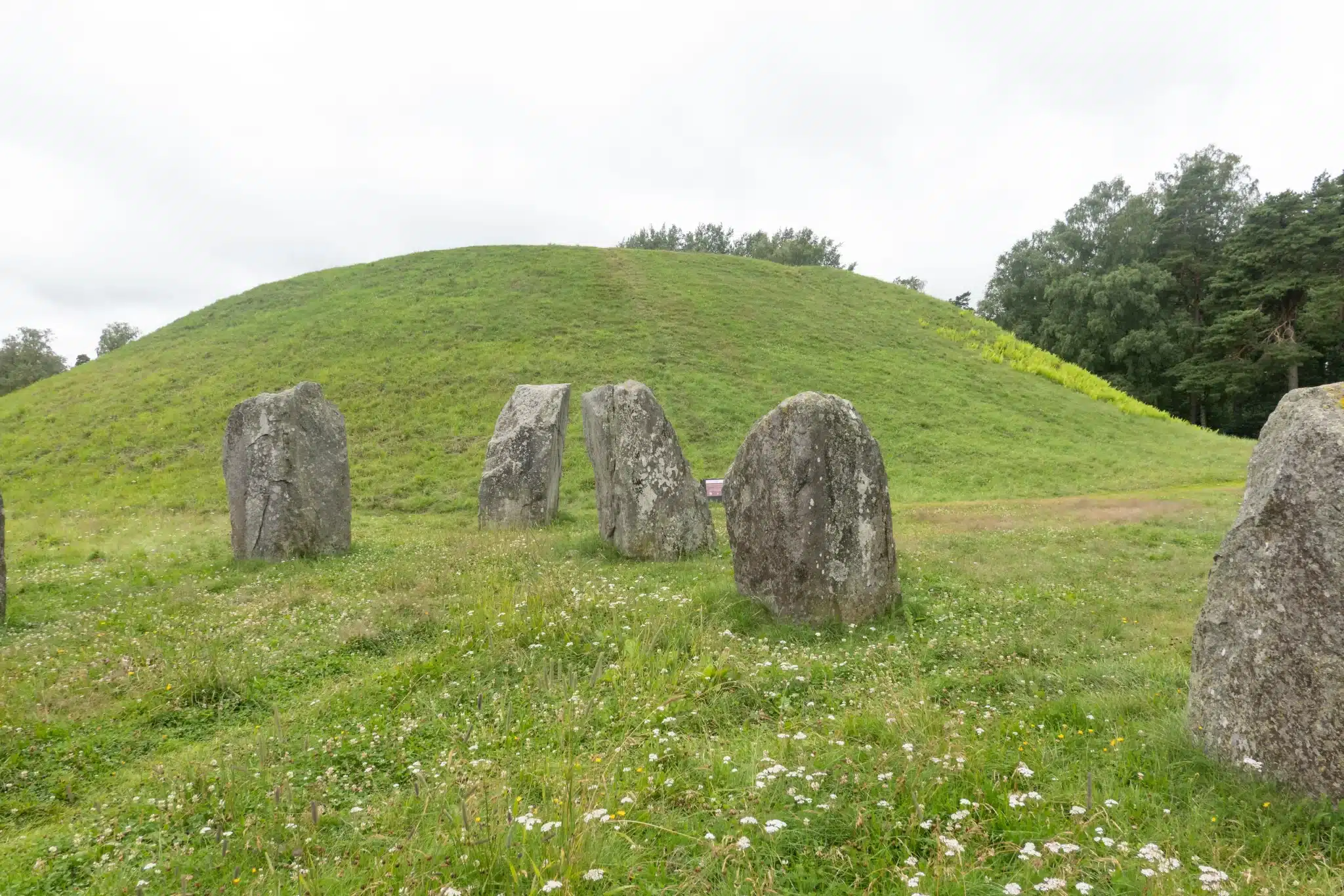 Ancient stone circle near grassy burial mound for Green Burial Services in Sonoma County